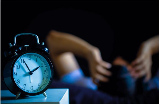 Image of man struggling to sleep